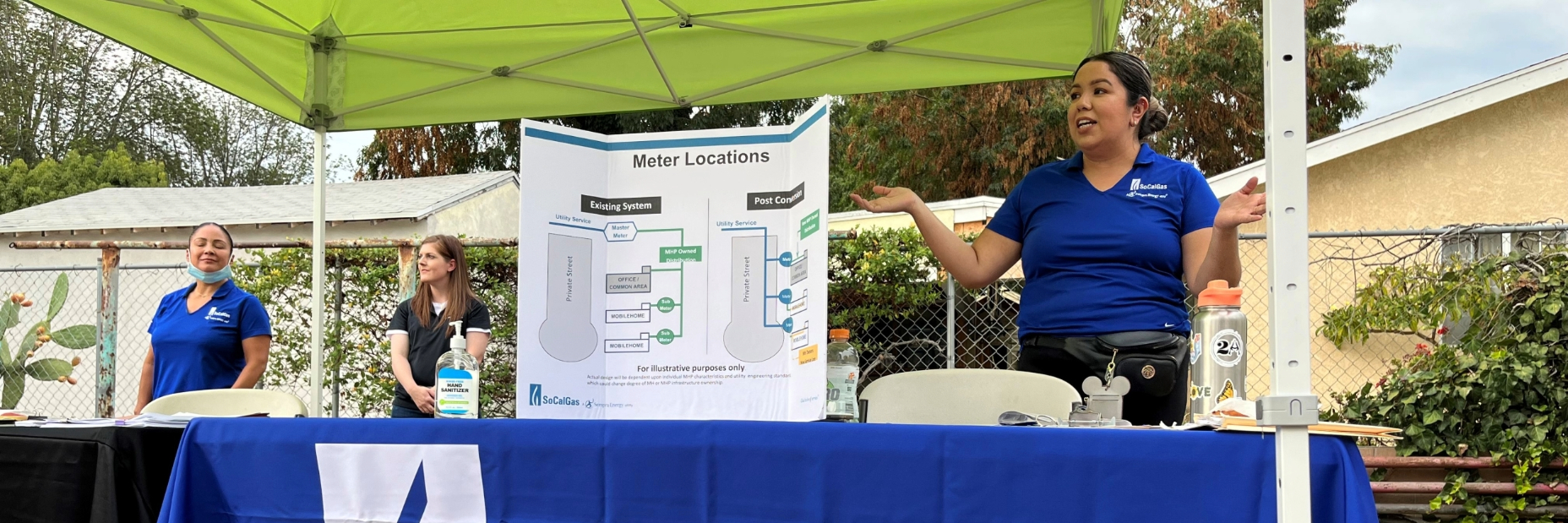 Information booth with employees standing at the ready to assist customers